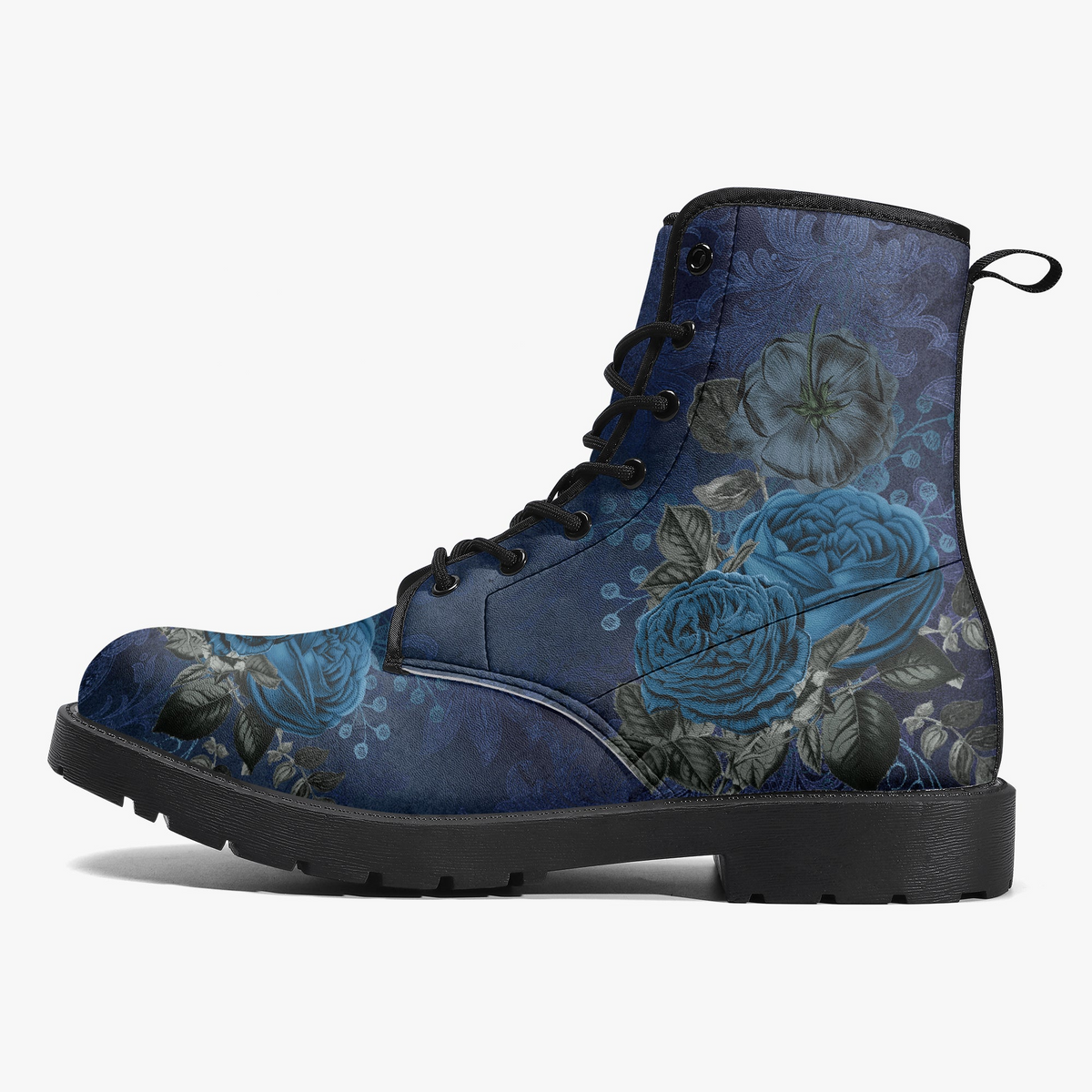 A single lace-up ankle boot shown in side profile on a light gray background. The boot has a dark blue floral print with large blue and gray roses, black laces, and a black sole.
